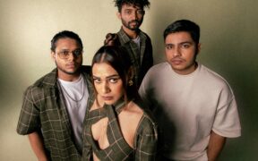 Shalmali Kholgade and her band wearing green and white posing for a photo