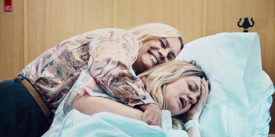 Donna hugs her daughter Sugar in a hospital in a screne from 'The Bear' season three.