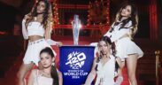 Indian girl group W.i.S.H. members pose with a tropy for the ICC Women's T20 World Cup song