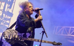 Robert Smith and the Cure performing