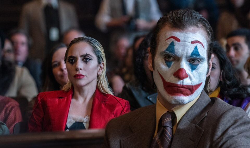 Lady Gaga (left) and Joaquin Phoenix in a courtroom scene from 'Joker: Folie a Deux.' 