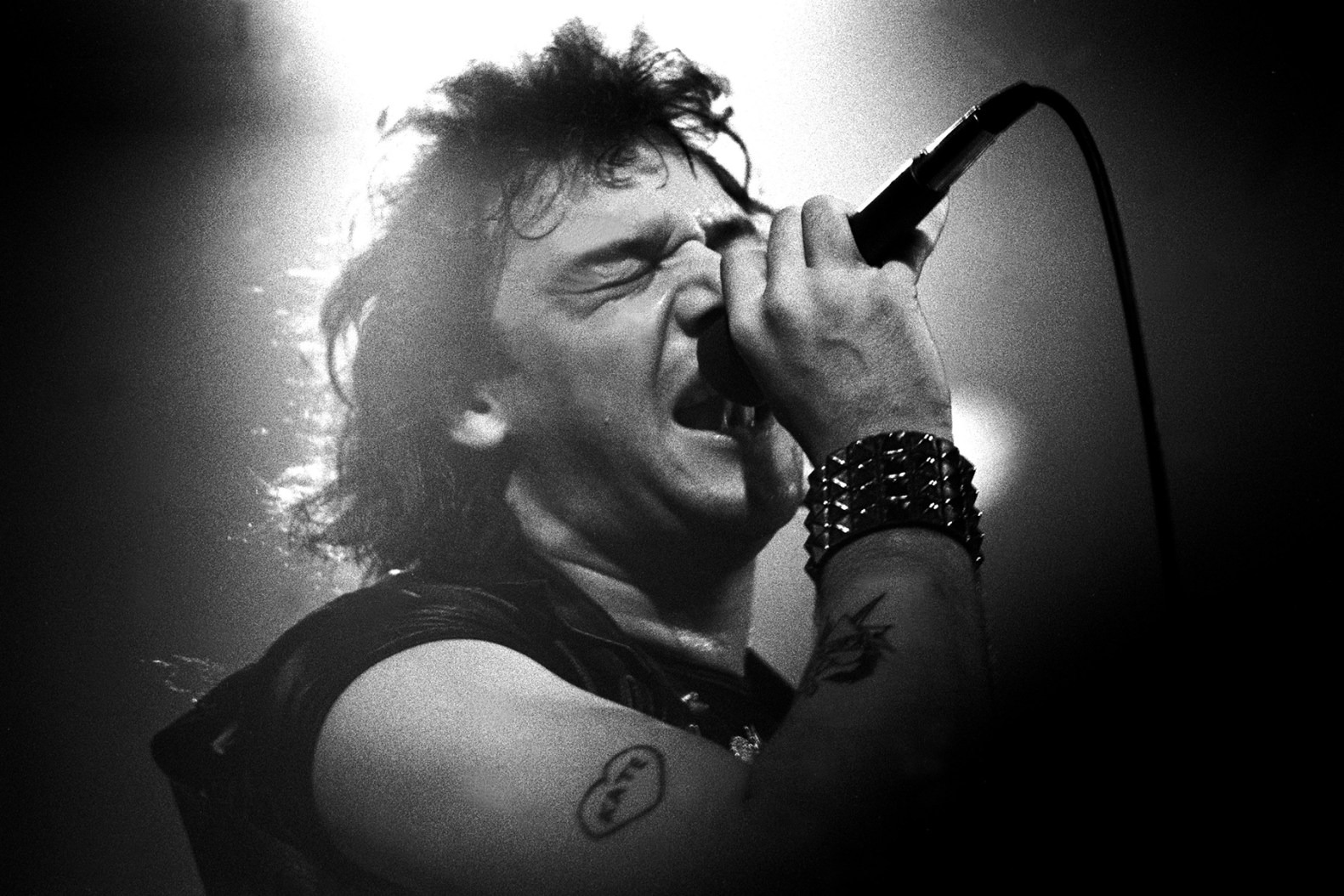 Paul Di'Anno of Iron Maiden singing with mic