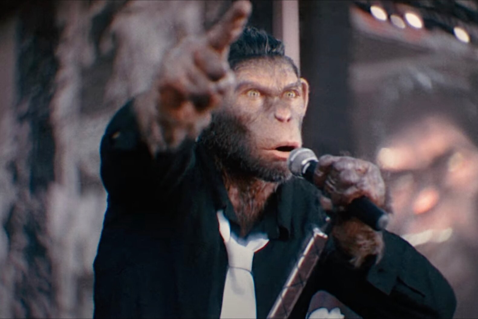 Robbie Williams Stars as Himself (as a Singing Monkey) in Teaser for ‘Better Man’ Biopic