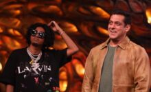 MC Stan in black and Salman Khan in a brown jacket smiling on the sets of 'Bigg Boss 16'