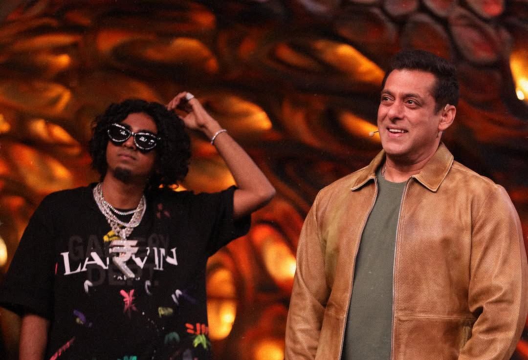 MC Stan in black and Salman Khan in a brown jacket smiling on the sets of 'Bigg Boss 16'