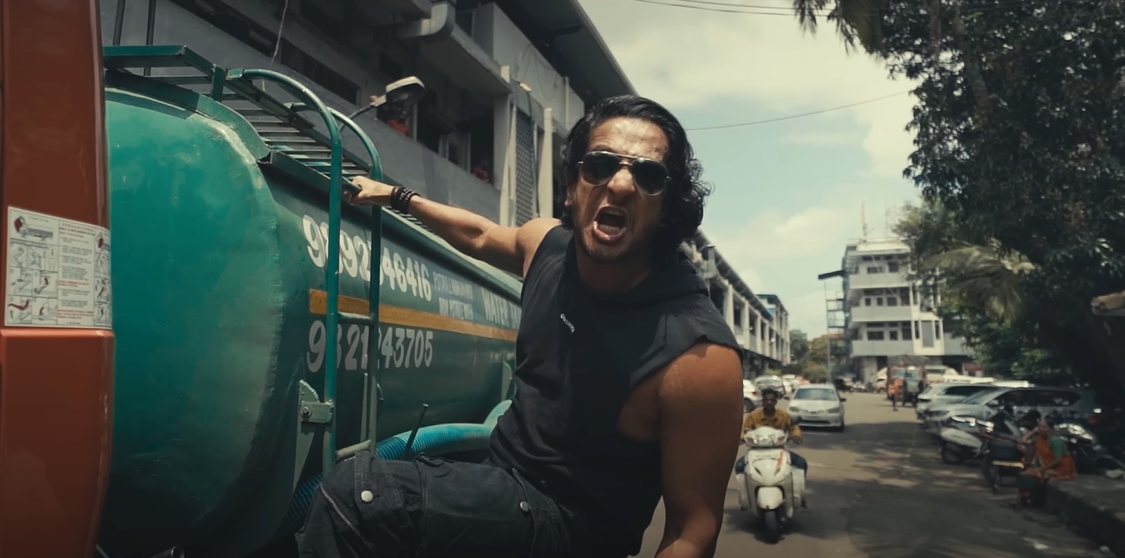 Zygnema vocalist Jimmy Bhore singing while hanging from a water tanker