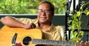 Susmit Sen with guitar, smiling