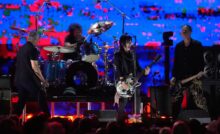 Joan Jett performs with Pat Smear, Dave Grohl, and Krist Novoselic of Nirvana during the FireAid benefit concert at the Kia Forum