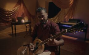 Artist Joy Sengupta playing Bouzouki