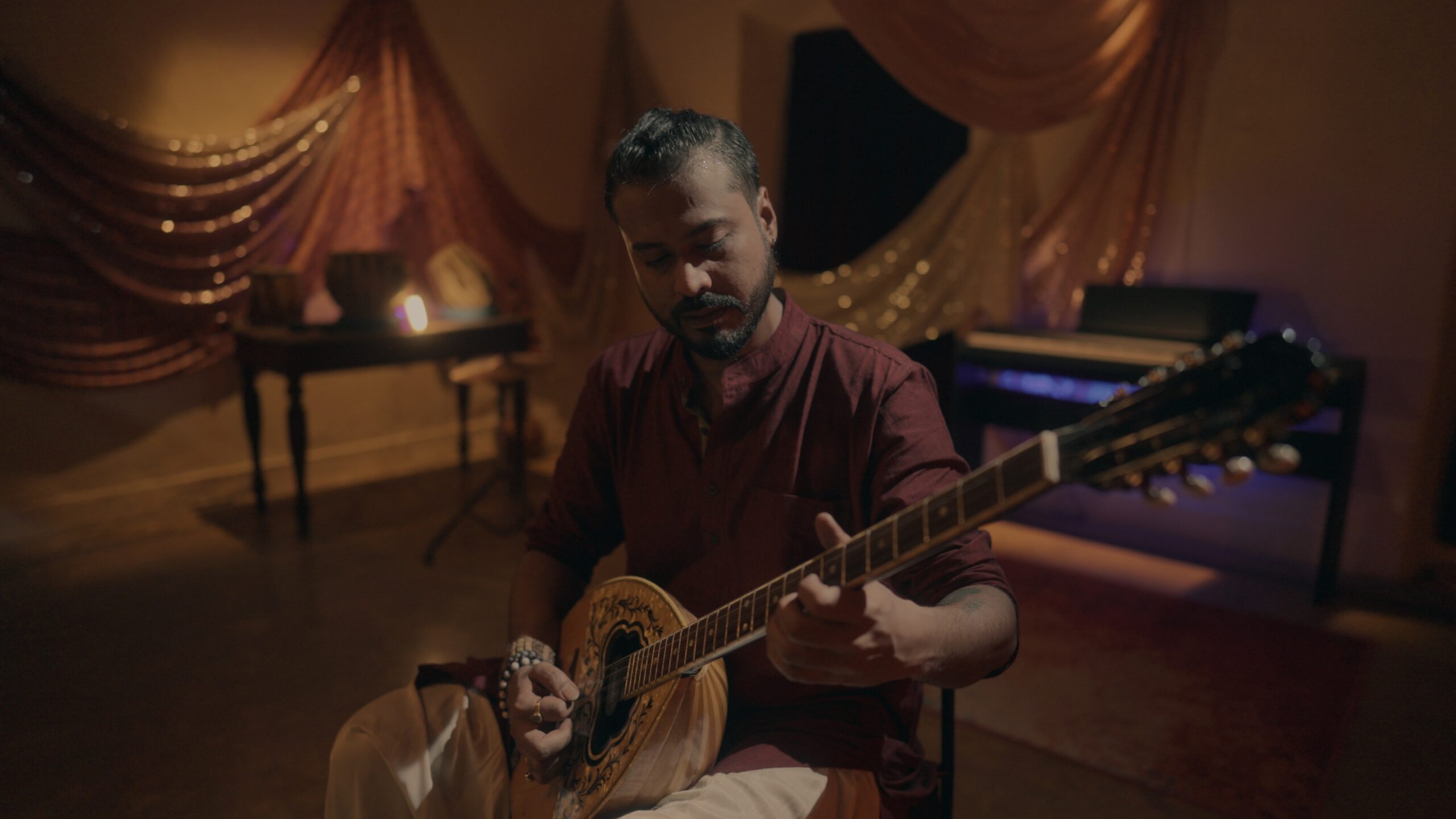 Artist Joy Sengupta playing Bouzouki