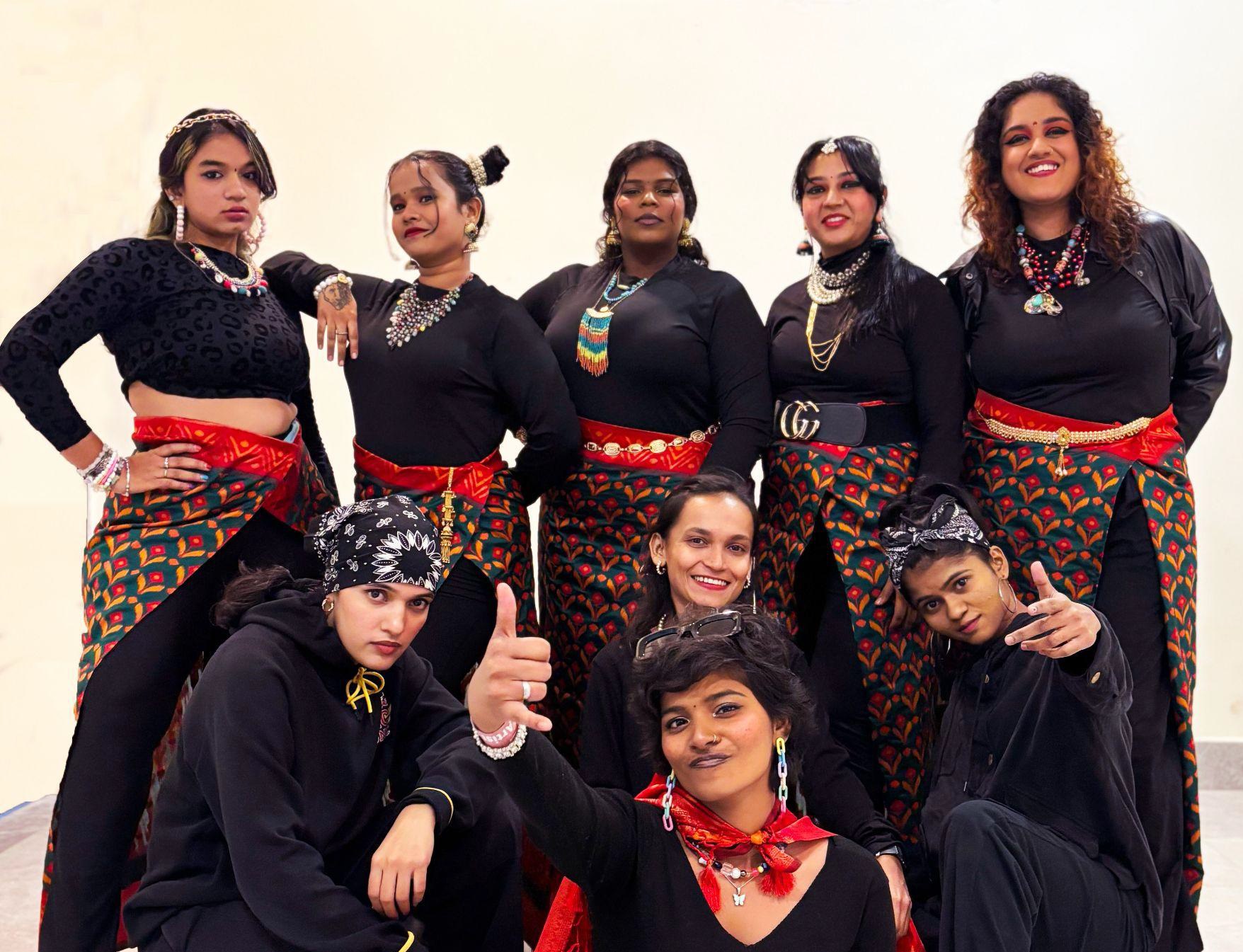 Members of all-female Indian hip-hop group Wild Wild Women pose for a photo in black attire