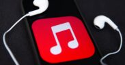 Headphones and Apple Music logo displayed on a phone screen