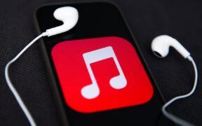 Headphones and Apple Music logo displayed on a phone screen