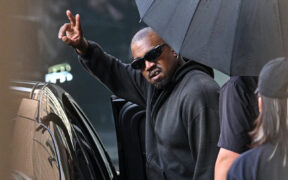 US rapper and producer Kanye West waves after arriving at Shanghai Pudong International Airport on July 11, 2025. Kanye West will hold a concert in Shanghai on July 12