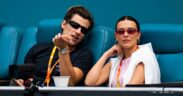 Jake Bongiovi and Millie Bobby Brown watch during the semi-final on Day 10 of the Miami Open at Hard Rock Stadium on March 27, 2025 in Miami Gardens, Florida