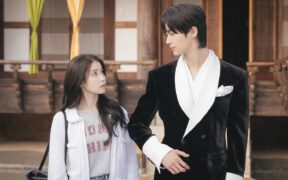 IU (left) and Byeon Woo-seok (right) in a still from 'Perfect Crown'